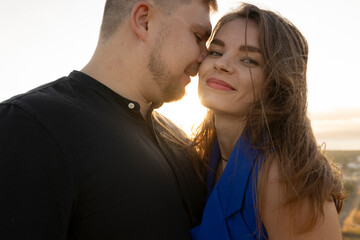 Loving couple embracing and enjoying a romantic sunset moment