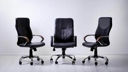 Fototapeta premium Office chairs are in a row. Dark office chairs on a white background.