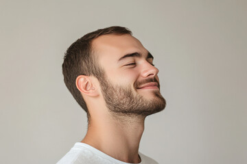 Obraz premium A close up of a man's face with his eyes closed