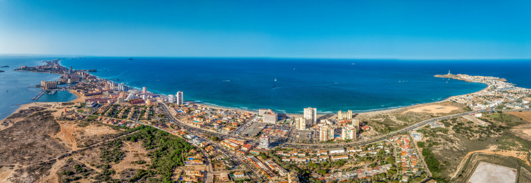 Aerial view of Cape Palos near La Manga and Mar Menor popular Spanish beach resort vacation town in Murcia Spain with lighthouse