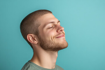 Obraz premium A close up of a man's face with his eyes closed