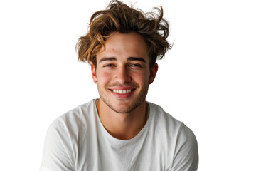 Handsome young man in a relaxed pose with a friendly smile on a white background.