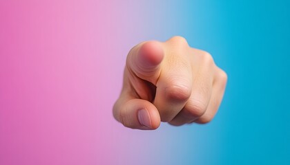 Hand pointing towards the viewer against a blue and pink gradient background