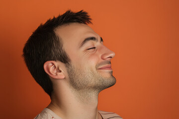 Obraz premium A close up of a man's face with his eyes closed