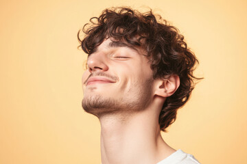 Obraz premium A close up of a man's face with his eyes closed