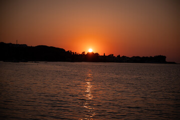 Naklejka premium the sun has almost set below the horizon