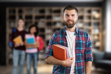 Academic success. Happy young student standing in classroom