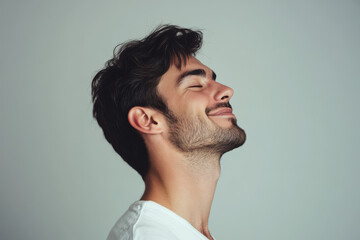 Obraz premium A close up of a man's face with his eyes closed
