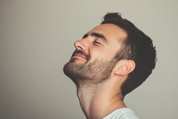 Obraz premium A close up of a man's face with his eyes closed