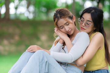 Fototapeta premium Couple of girl with girl,LGBT Pride month concept,Asian Handsome male make up and wear woman cloth,Gay Freedom Day,Portrait of Non-binary on white background