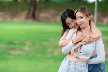 Couple of girl with girl,LGBT Pride month concept,Asian Handsome male make up and wear woman cloth,Gay Freedom Day,Portrait of Non-binary on white background