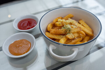French fries with sauce on the table