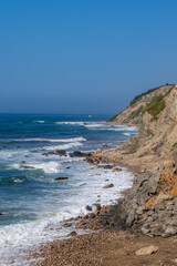 Vertical photo of the beach at Mohegan Bluffs, Block Island, Rhode Island, USA.  August 2024.
