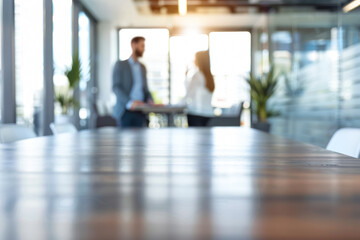 Fototapeta premium Blurred image of a modern office meeting room with two business professionals in the background, capturing the essence of a contemporary workplace