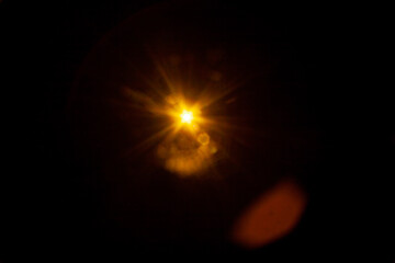 Sun flare on the black background