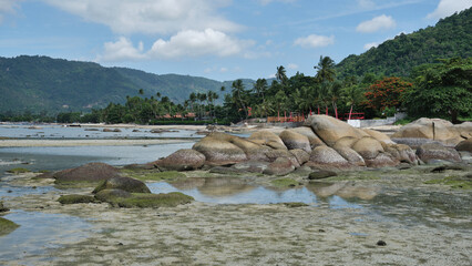 Boulders at low tide on Lamai Beach, Koh Samui, Thailand
