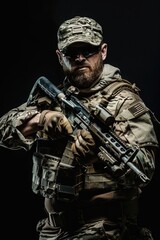 Fototapeta premium A person wearing camouflage clothing and holding a rifle or shotgun, possibly for hunting or outdoor activities