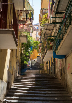 Fototapeta Naples, Narrow city street with stairs in naples spanish quarter in italy