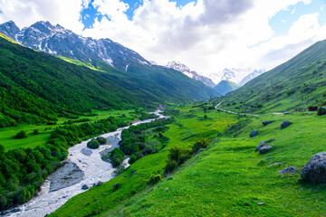 Obraz premium Beautiful view of the valley of the mountain river among the high mountains. The North Caucasus. Russia