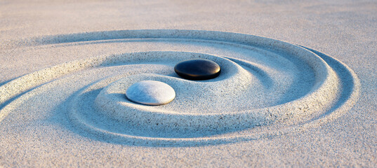 Yin Yang Motiv - Steine im Sand	
