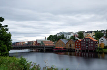 Obraz premium View of warehouses at the Nidelva river in Trondheim, Norway.