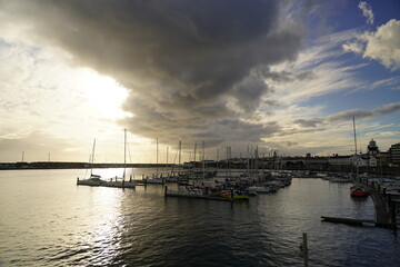 sunset over the harbor in Azores