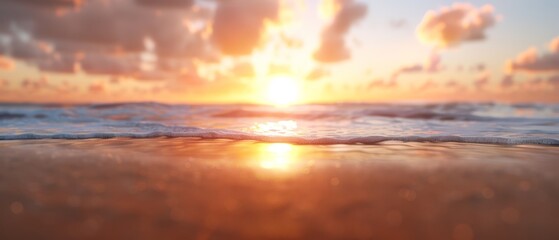 Obraz premium The sun sets over the ocean, with a foreground wave and clouds in the background sky