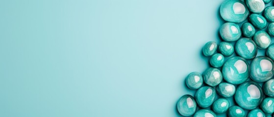  A blue tabletop holds a stack of blue and white candies against a light blue background