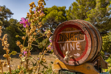 An old wooden wine barrel advertising a Croatian winery producing red and white wine