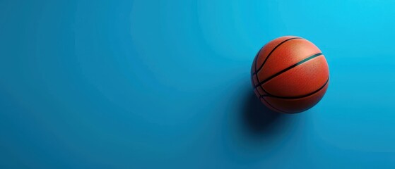 Basketball on a blue background with space for text. Free copy space for text.