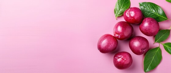  A red apple cluster with green leaves against a pink backdrop Include area for custom text or image
