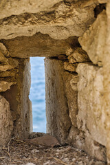 View through a window in the walls of the Venetian fortress in the town of Rethymno in Crete