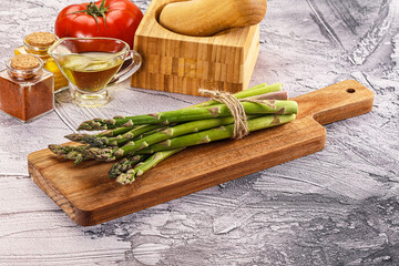 Vegan raw green asparagus heap