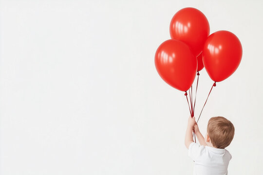 Young boy holding red balloons for Duchenne Awareness Day, Promoting muscular dystrophy genetic disease awareness