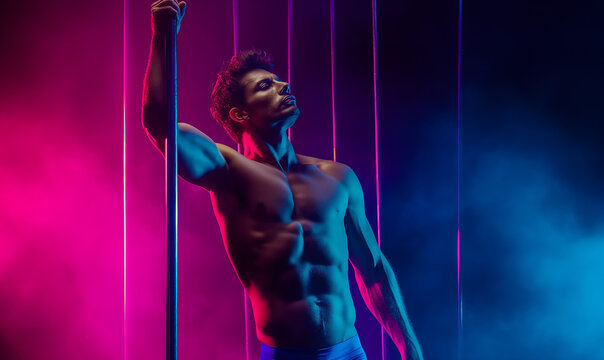 Sexy man with muscular body and bare torso Young strong sexy pole dance man 