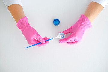 A brush for taking a swab from the cervical canal of the female  organs for examination for the presence of cancer cells