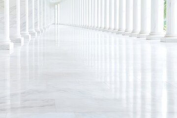 An elegant and bright corridor featuring marble flooring and classic columns, creating a serene and timeless atmosphere.