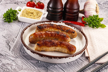 Delicous natural roasted sausages in the plate