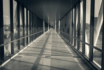 Modern Glass Corridor with Shadows