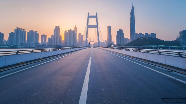 Asphalt highway road and city skyline with modern buildings at sunset 
