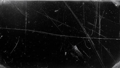 Dusty scratched and scanned old film texture with cracks; dirty grunge style overlay for photo or banner