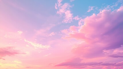 A serene sky at dusk with soft pink and blue hues blending together.