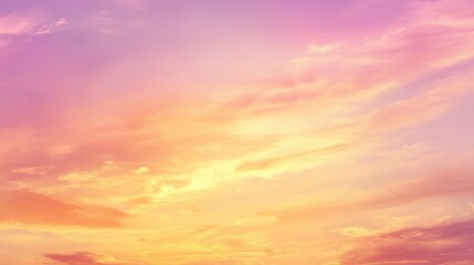 Fototapeta premium A serene sky at sunset with soft pink and orange hues blending into the clouds.
