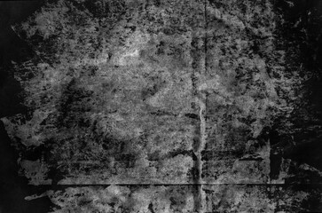Black and white grunge vintage texture layer with paint splotches and stains on old creased worn paper