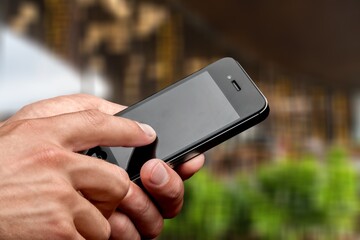 Business person hands hold phone