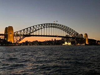 Naklejka premium Sydney harbour bridge 21 July 2024 at sunset
