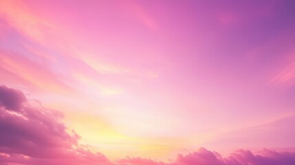 Fototapeta premium A serene sunset sky with soft pink and orange hues blending with clouds.