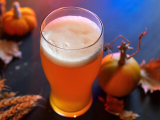 Pumpkin beer ale on the table, close-up. Celebrate Thanksgiving