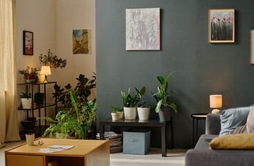 Fully equipped living room with huge number of plants in pots