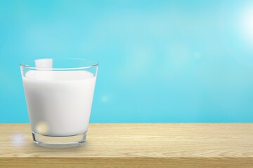 Glass of tasty fresh milk on desk